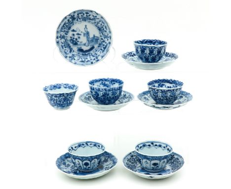 Floral decor with Chinese figures, saucers are 11 cm. in diameter.