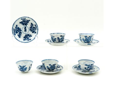 Blue and white floral decor, marked with double ring and Linzhi sacred fungus, saucers are 11 cm. in diameter. 