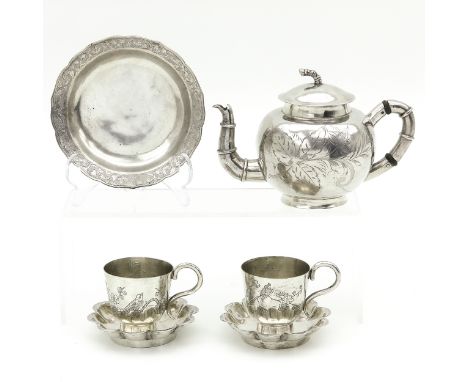 Including teapot, 2 cups and saucers and small dish, teapot is 12 cm. tall.