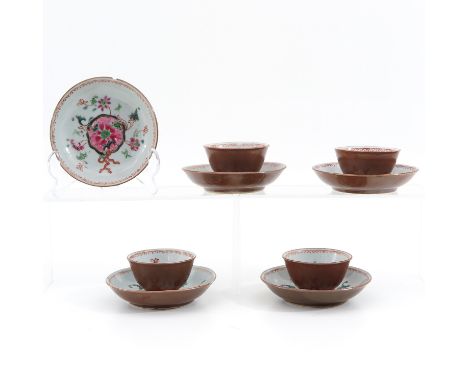Famille Rose floral decor, including 4 cups and 5 saucers, 18th Century, saucers are 11 cm. in diameter, chip and hairline.