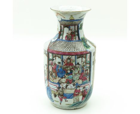 Depicting Chinese figures gathering in pagoda and playing games, 35 cm. tall.