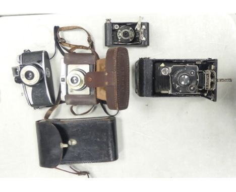 Four Vintage Cameras, includes Agilux Agiflash, A Leather Cased Kodak A118 Bellows Camera, Kodak Vest Pocket Model B and a le