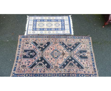 Two Vintage Rugs including larger Persian geometric examples with smaller blue and white example. Length of largest: 220cm (2