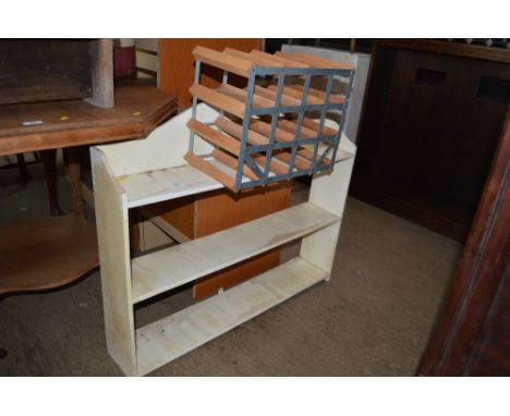 A painted book shelf and a wine rack