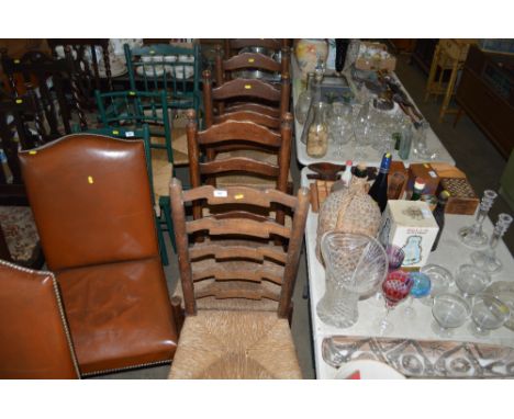 Five oak ladder back and rush seated chairs 