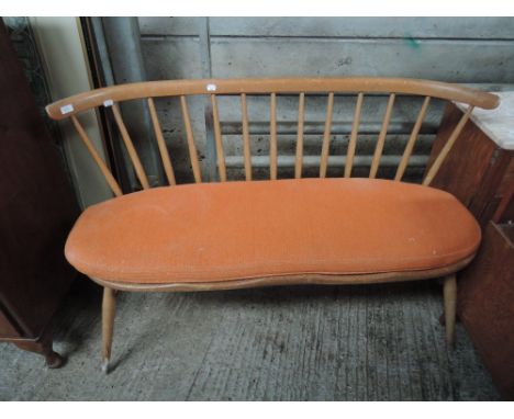 An Ercol elm spindle back settee