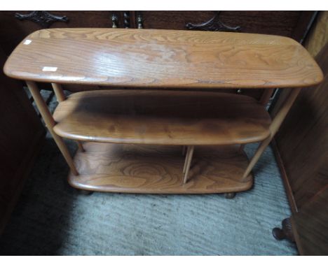 A 1960's/70's Ercol elm three tier trolley bookshelf