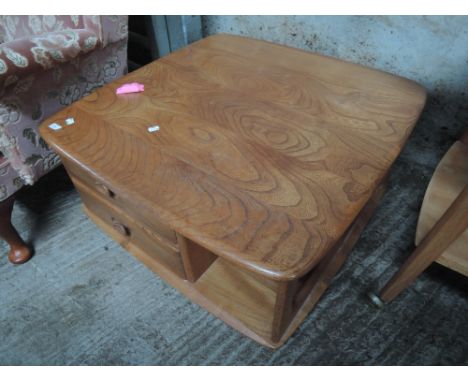 An Ercol elm coffee table with drawer base 