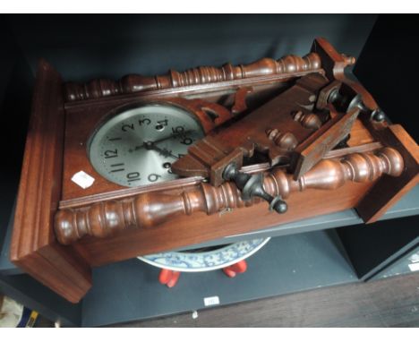 A reproduction stained frame Vienna style wall clock