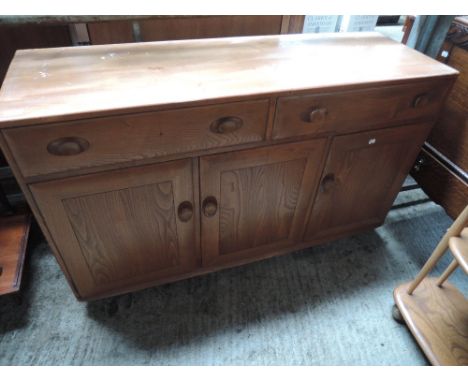 A 1970's Ercol elm sideboard unit
