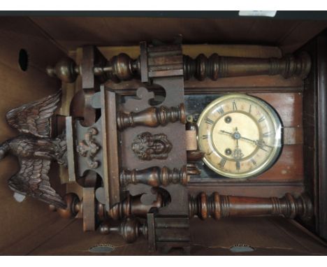 An early 20th century stained frame Vienna wall clock