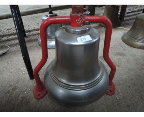 A fire engine bell on frame 