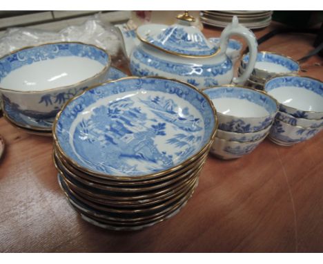 A part willow pattern tea service including tea bowls