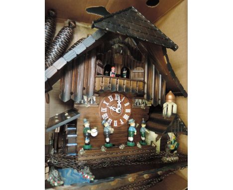 A traditional Swiss Black Forest cuckoo clock of large size