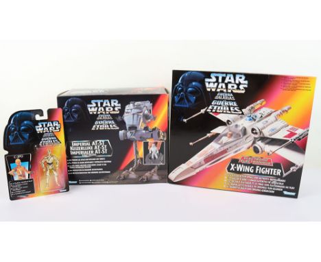 Three Kenner 1990s Star Wars figures, includes 1996 Imperial AT-ST with Charging leg attack and rotatable gun turrets, 1995 E