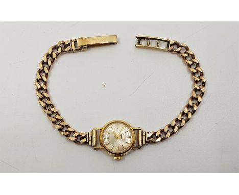 A Tissot 18ct. ladies' wrist watch, cal.709, having signed silvered circular dial with gold baton hour markers, 17mm wide Swi