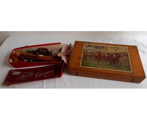 A table top croquet game and a cased Minoru Racing game comolete with lead horses and gambling cloth