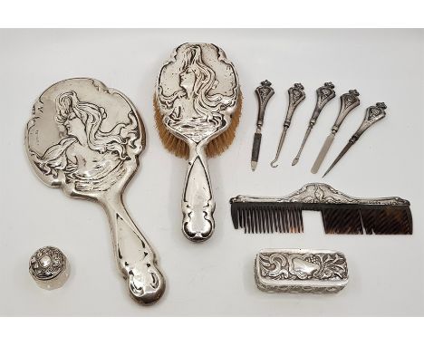 A collection of Art Nouveau silver mounted vanity items, to include: a hand mirror and hair brush, by L &amp; W, Birmingham 1