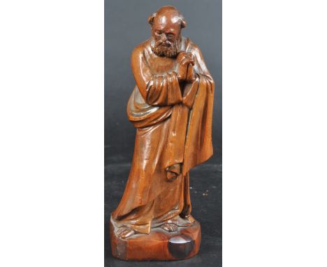 An early 20th Century carved fruitwood religious ecclesiastical figurine depicting a Saint / Holy figure.&nbsp; The figure mo