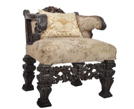 A 19th Century carved oak throne armchair. Ornate carved back rest with twin scrolled arms. Overstuffed seat with tapestry up