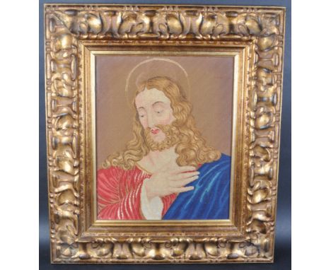 A 19th Century Victorian religious ecclesiastical needlepoint tapestry depicting Christ in blue &amp; red robe with hand rais