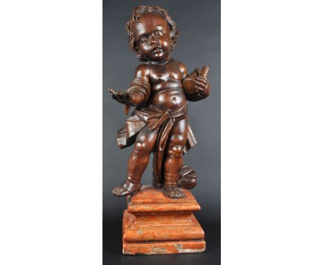 A large 19th Century carved wood figurine depicting a cherub / putti. The figure of large size with one hand outstretched and