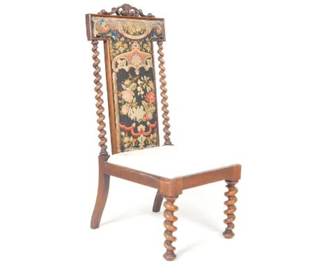 A 19th Century Victorian walnut prie-dieu prayer chair / side chair having a 'T' form backrest with carved 'c' scroll top dec
