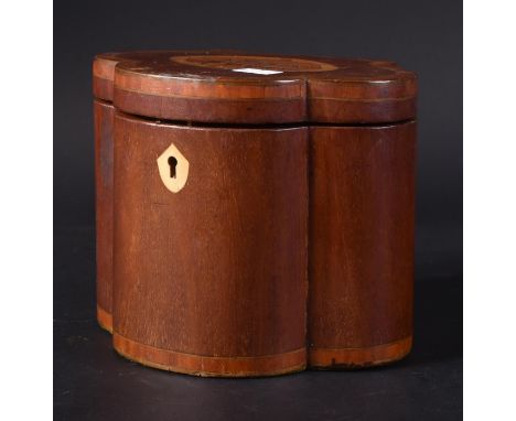 A 19th Century George III inlaid mahogany tea caddy having a hinged cover with shell detailing. The caddy of trefoil from. Me