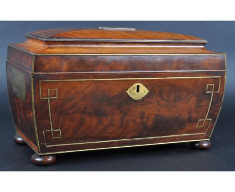 A 19th Century Regency &amp; brass inlaid tea caddy of sarcophagus form having shaped side and sides with inlaid brass work t