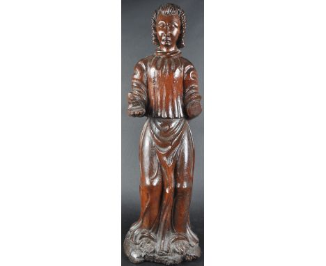 A large 19th Century carved religious ecclesiastical figurine depicting a Saint or Holy figure. The figure modelled standing 