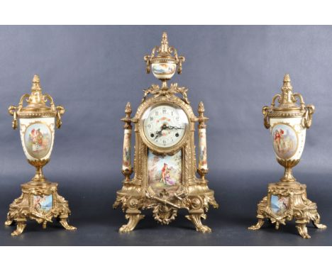 A 20th Century gilt ormolu &amp; porcelain mantel clock and garniture set. Featuring a pair of classical urn form garnitures 