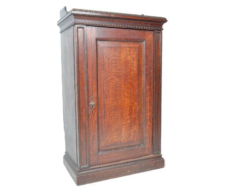 Holland &amp; Sons (stamped) - An original 19th Century large mahogany upright pedestal cabinet having a shaped gallery top, 