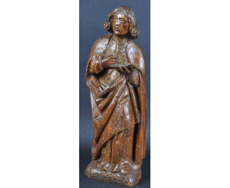 A 19th Century carved walnut religious ecclesiastical figurine depicting a Saint / Holy Figure. The figure modelled standing 