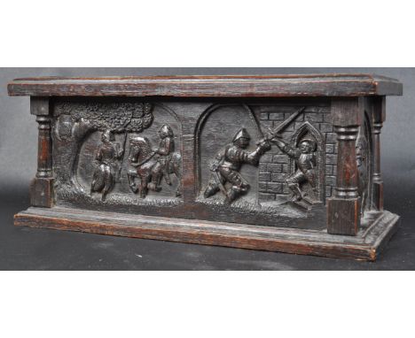 A 19th century carved oak miniature coffer - box.&nbsp; The wooden box has carvings depicting battle scenes to all four side 