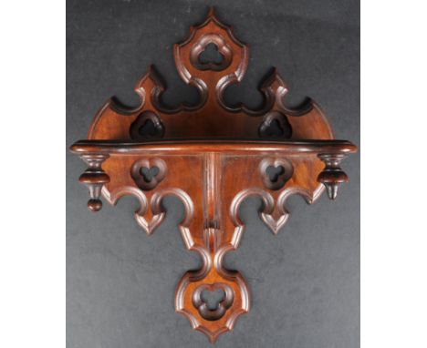 A 19th Century carved oak ecclesiastical religious wall mounted clock bracket shelf. Gothic in design with Pugin inspired pie