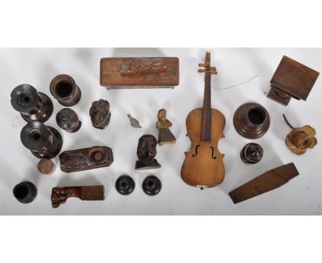 A large collection of treen. To include: a decorative trinket box, a miniature bible lectern. curved cups repurposed as candl