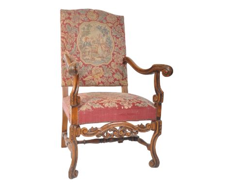 A large 19th Century George III walnut and tapestry upholstered throne armchair / fireside arm chair. The chair having an arc