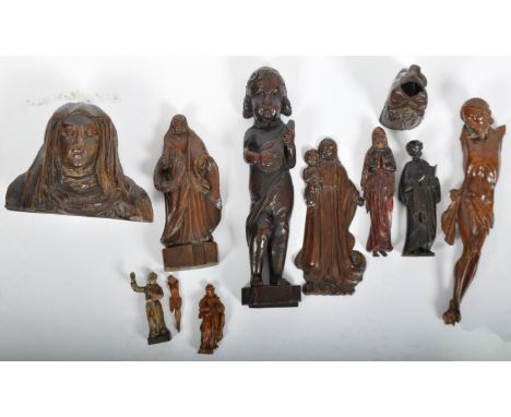 A collection of 11 x 19th century carved wooden religious figures. Examples to include: a carved mahogany figurehead of Mary,