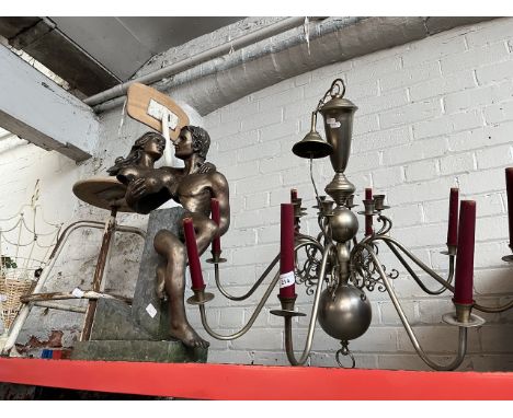 A large vintage style metal light fitting, a composite group figure, an industrial style chair and a metal umbrella / stick s