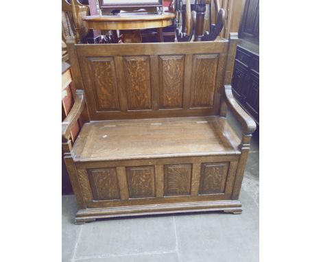 An oak monk's bench, width 113cm. 