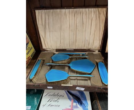 A cased blue enamel vintage dressing table set. 