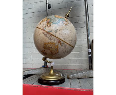 A vintage globe on brass stand.In good condition. 