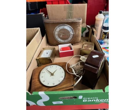 A box of clocks to include a coin clock. 