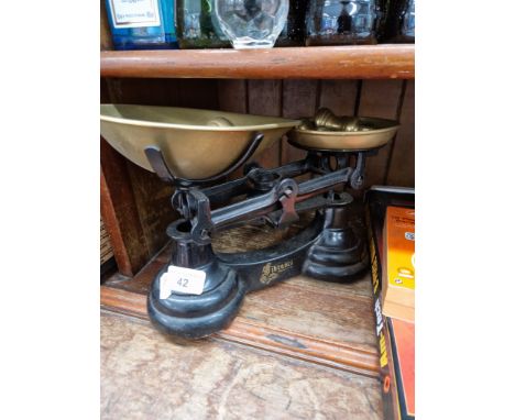 A set of Fibasco kitchen scales with brass bell weights.