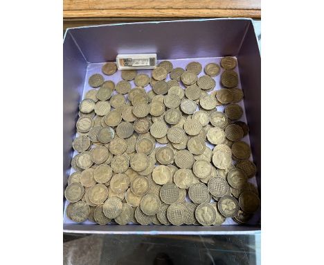 A box containing pre decimal 3d pieces and a miniature harmonica 