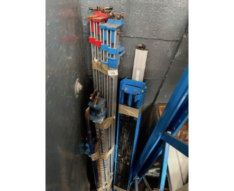 A quantity of sash clamps and two crow bars 