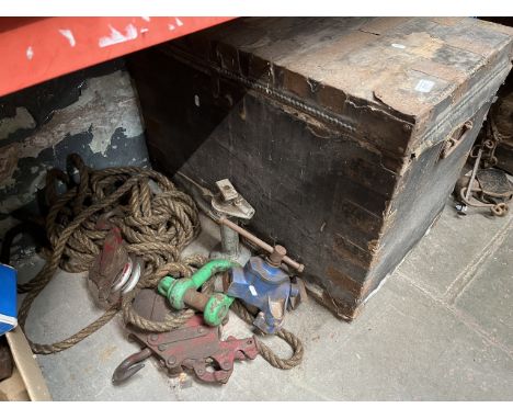 A large metal bound trunk and block and tackle, a jack and a Record engineering plank vice. 