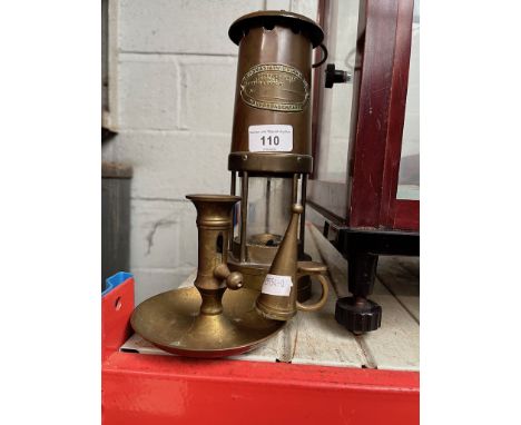 A brass miners lamp, a brass candle holder and snuffer 