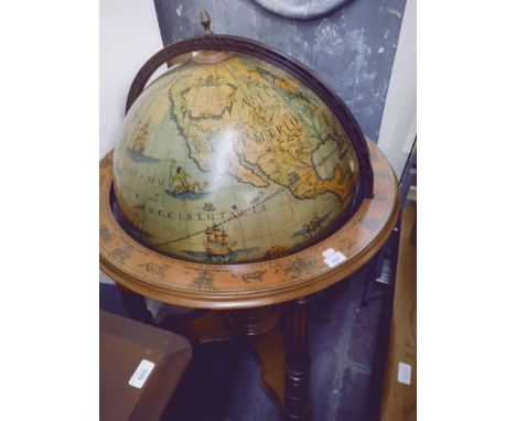 A reproduction terrestrial globe on stand. 