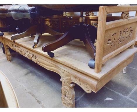An eastern carved wood bench decorated with dragons, length 200cm. 